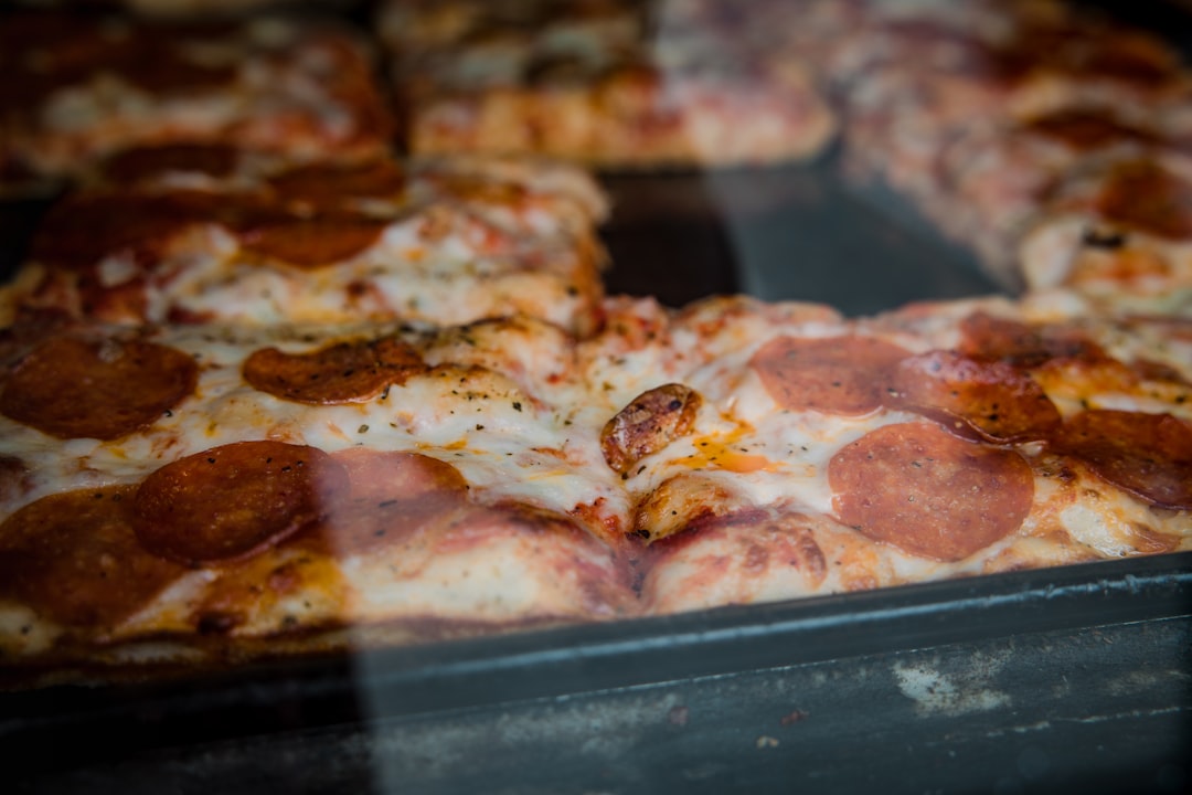 pizza on stainless steel tray