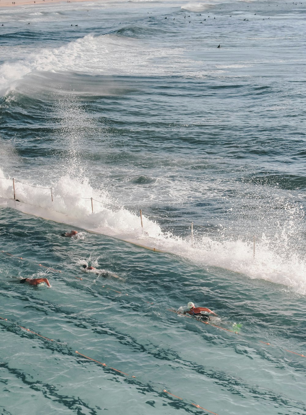 people surfing on sea waves during daytime