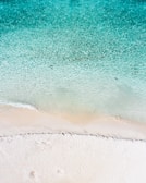 A stunning beach with crystal clear blue waters.