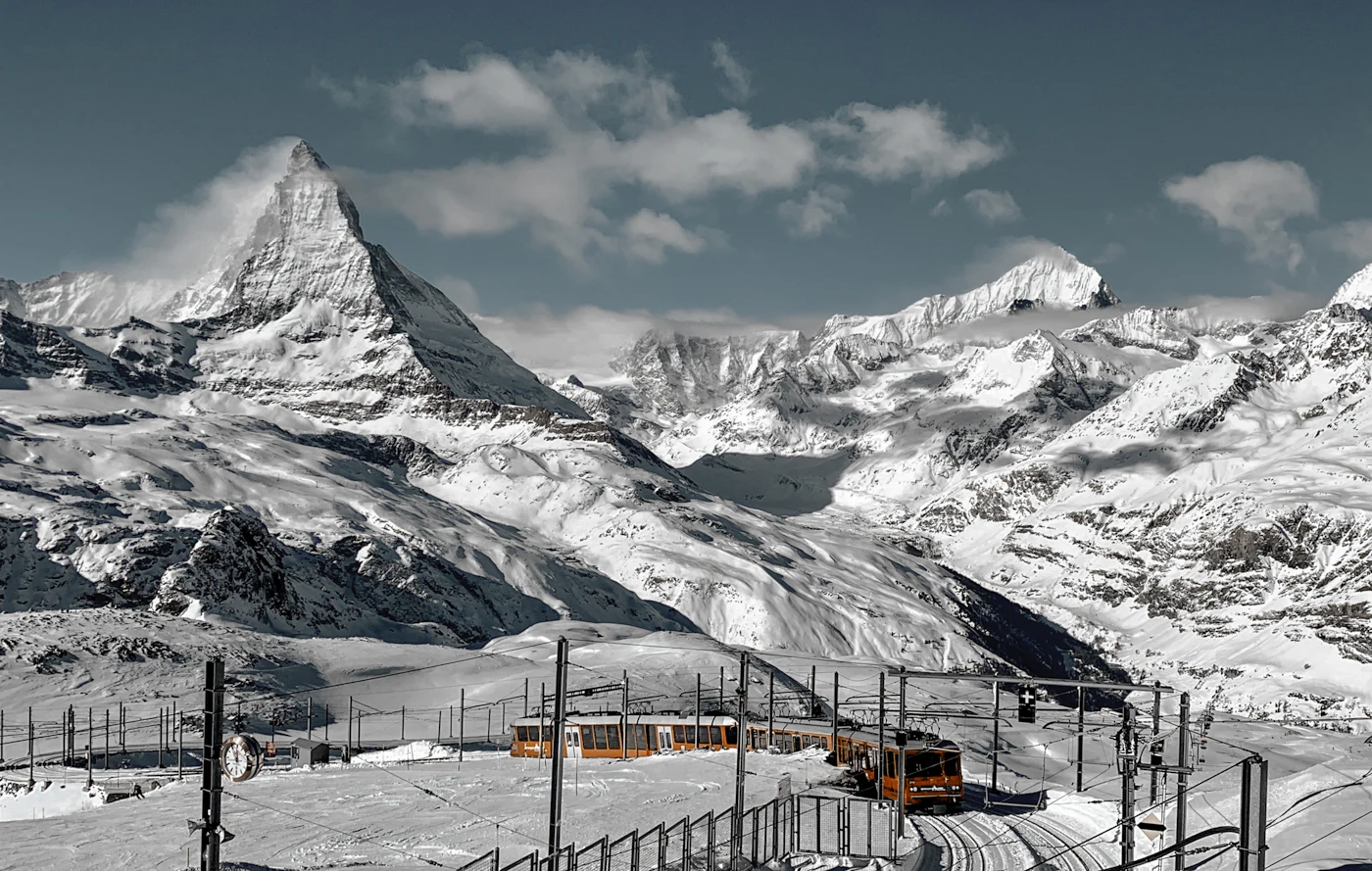 The snow-covered Matterhorn above Zermatt under a blue sky