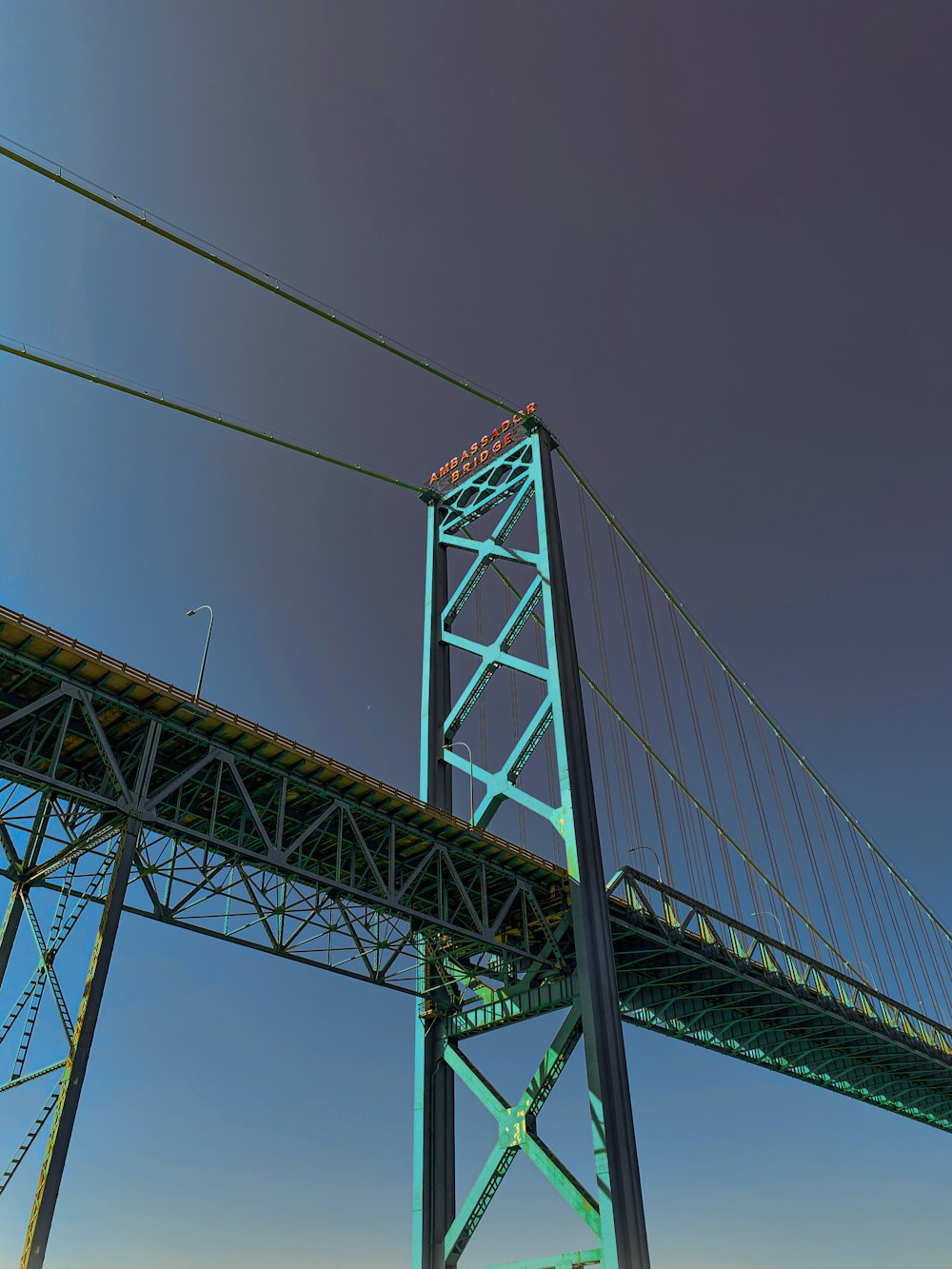 green metal bridge under blue sky during daytime