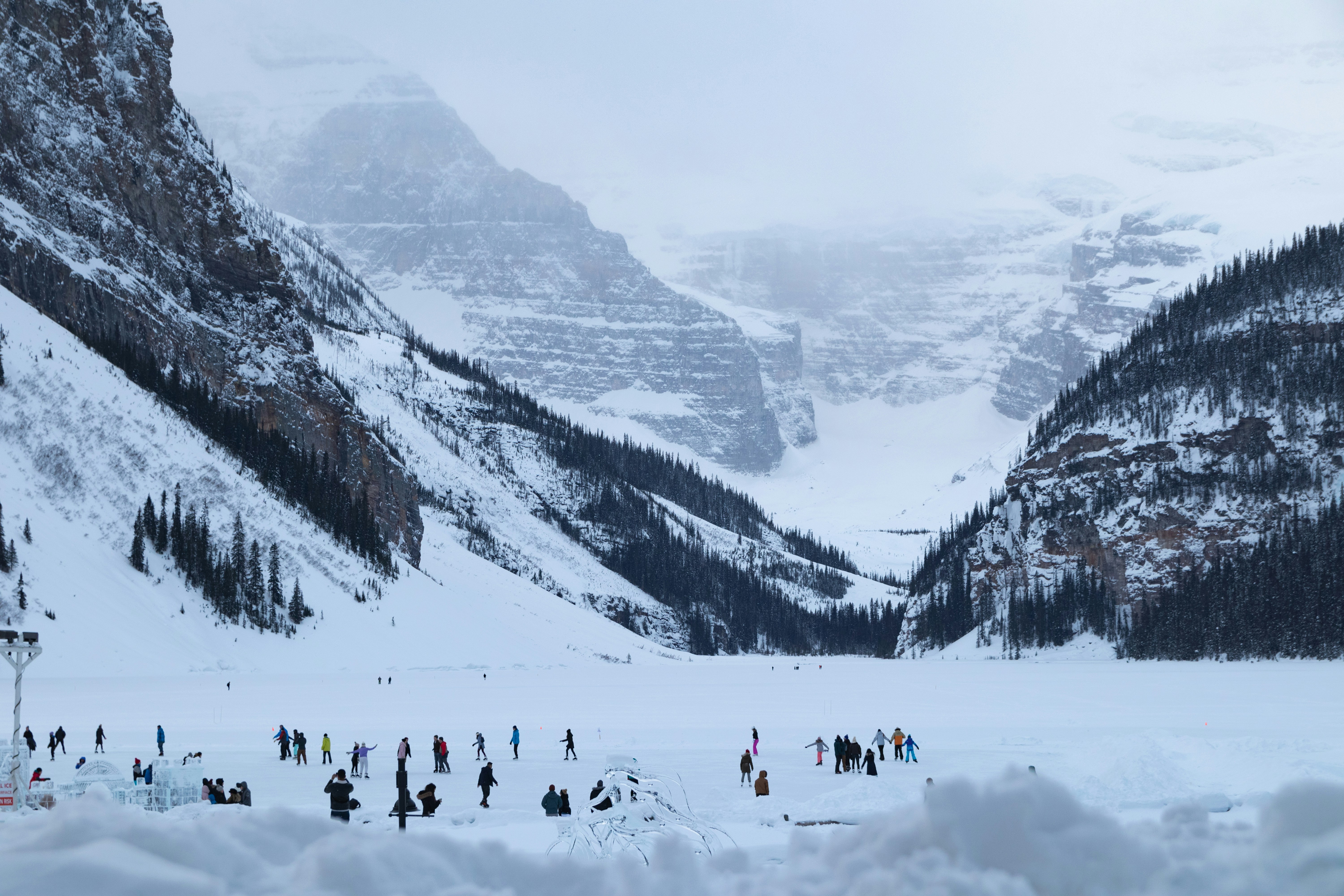 people walking on snow covered ground during daytime