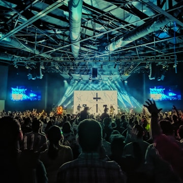 people gathering on concert during night time