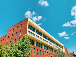 brown concrete building under blue sky during daytime