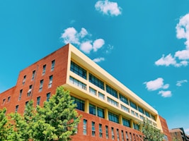 brown concrete building under blue sky during daytime