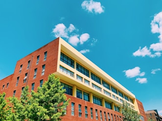brown concrete building under blue sky during daytime