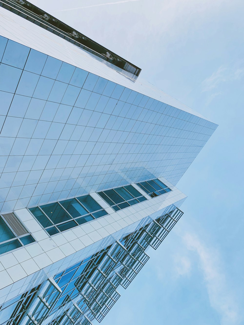 white concrete building under blue sky during daytime