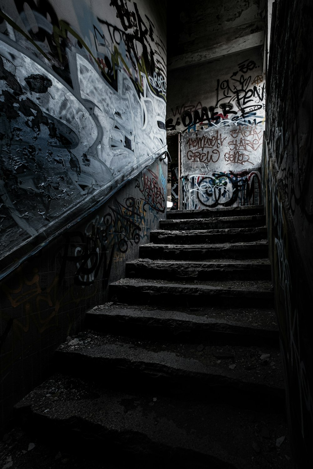 black staircase with white and blue wall paint