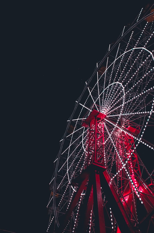 red and white ferris wheel in Luna Park Sydney Australia