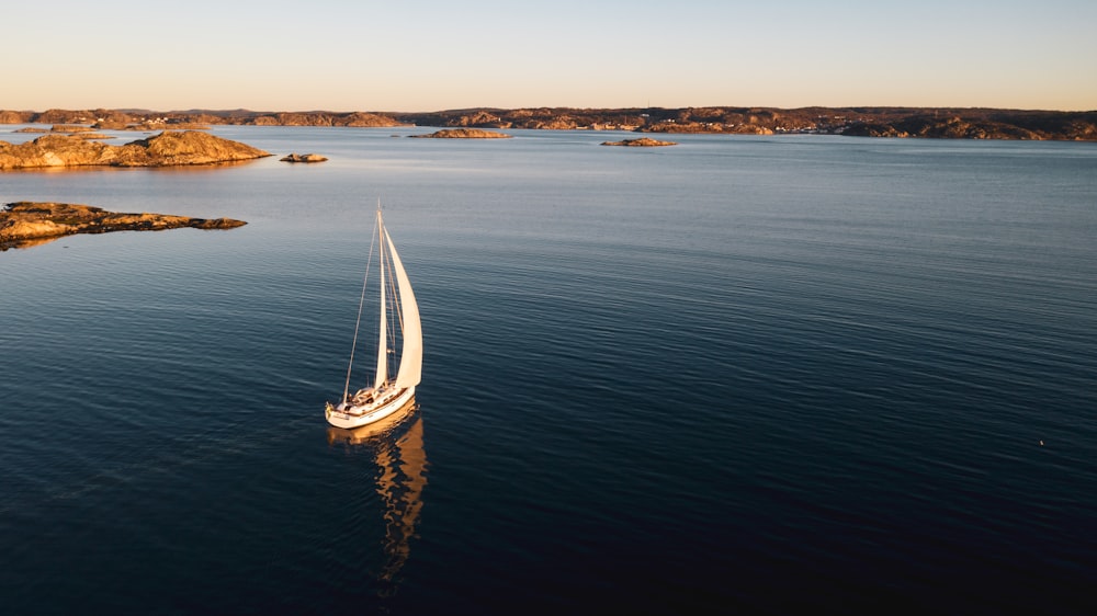 white sailboat on sea during daytime