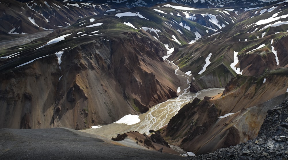 brown and white rocky mountain under white sky during daytime