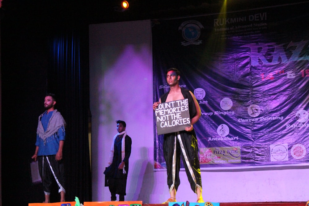 man and woman standing on stage