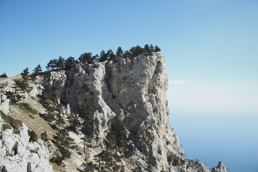 gray rocky mountain under blue sky during daytime