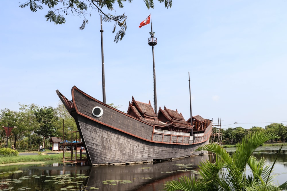 brown wooden boat on water