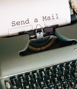 black and white typewriter with white printer paper