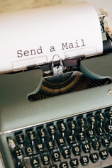 black and white typewriter with white printer paper