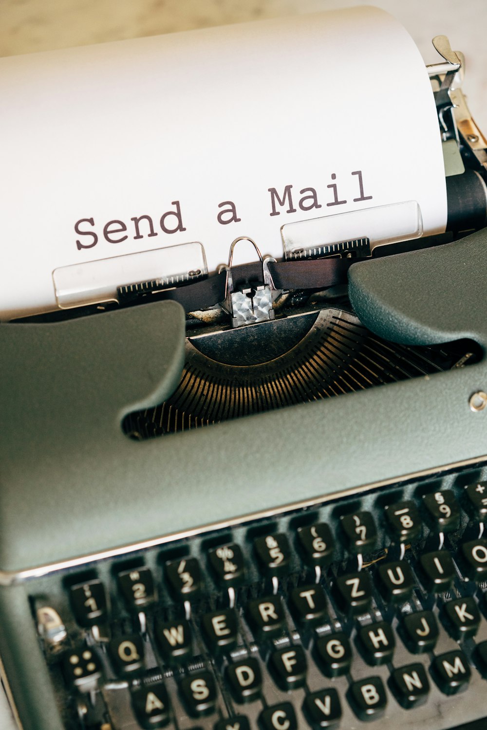 black and white typewriter with white printer paper