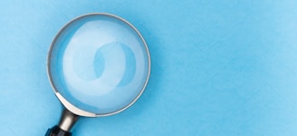 magnifying glass on white table
