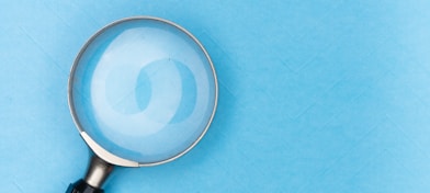 magnifying glass on white table