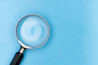 magnifying glass on white table