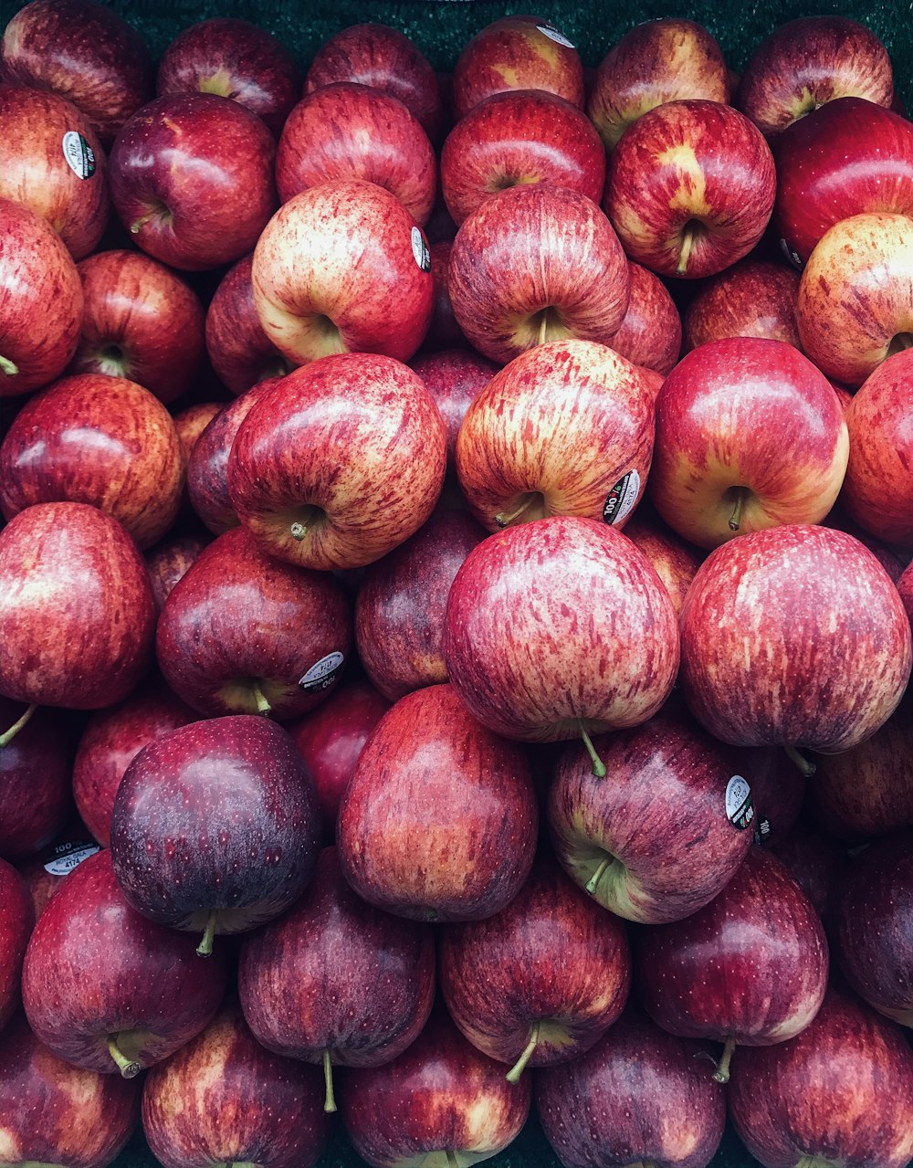 red round fruits on brown wooden table