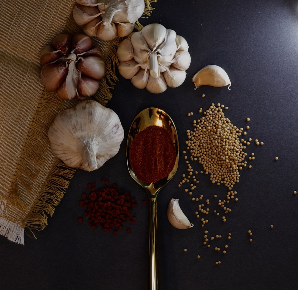 garlic and garlic on black textile