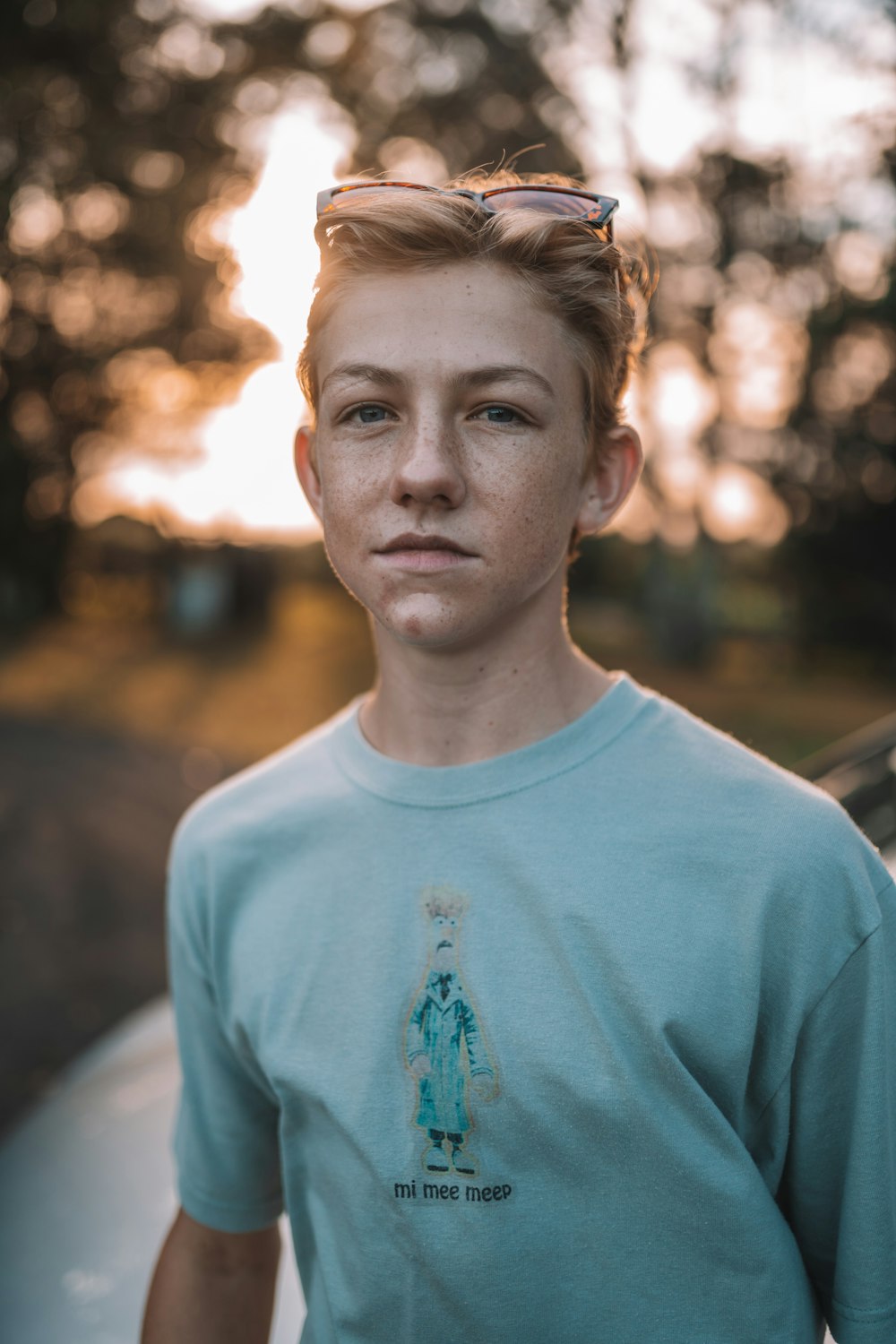 man in white crew neck shirt standing near trees during daytime