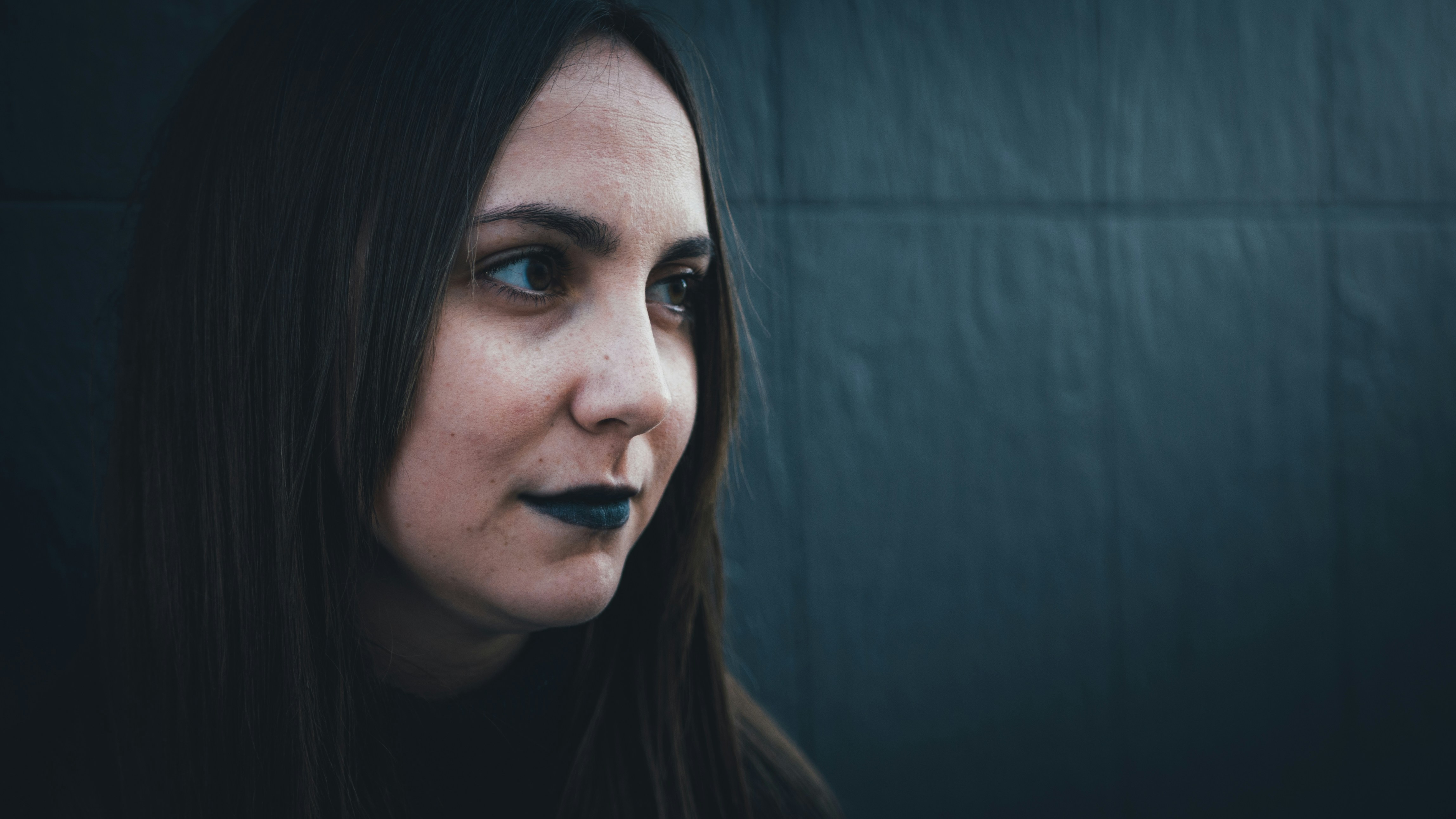 woman with black hair and blue eyes
