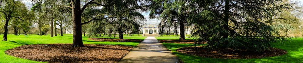 white concrete building near green trees during daytime