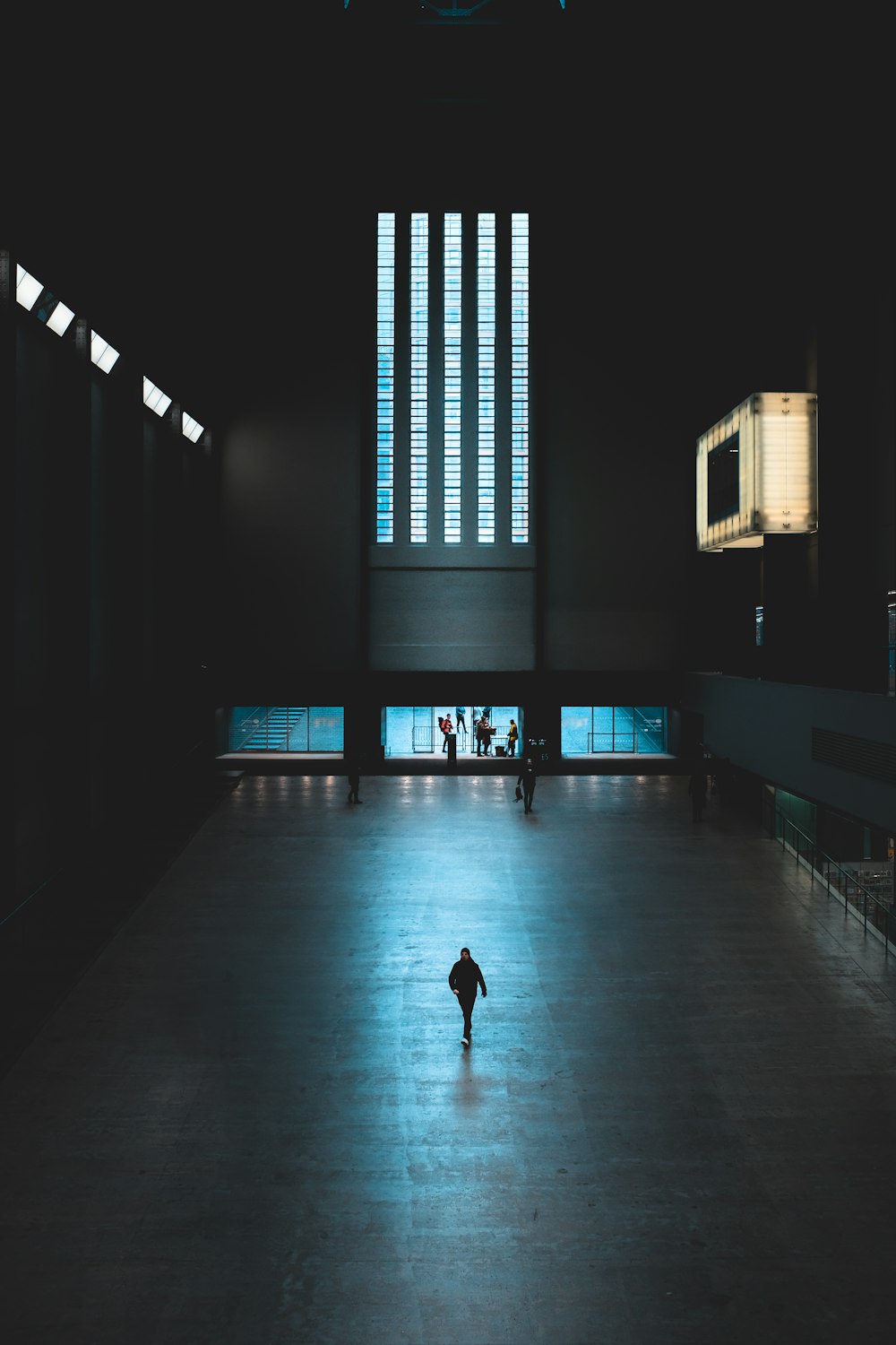 silhouette of person walking on hallway