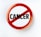 A circular badge with a red border and slash through the word 'CANCER' printed in bold black letters on a white background, symbolizing opposition or prohibition.