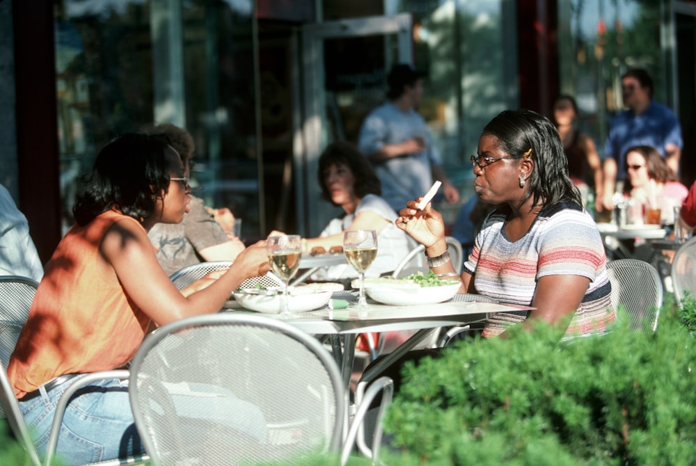 people sitting on chair eating