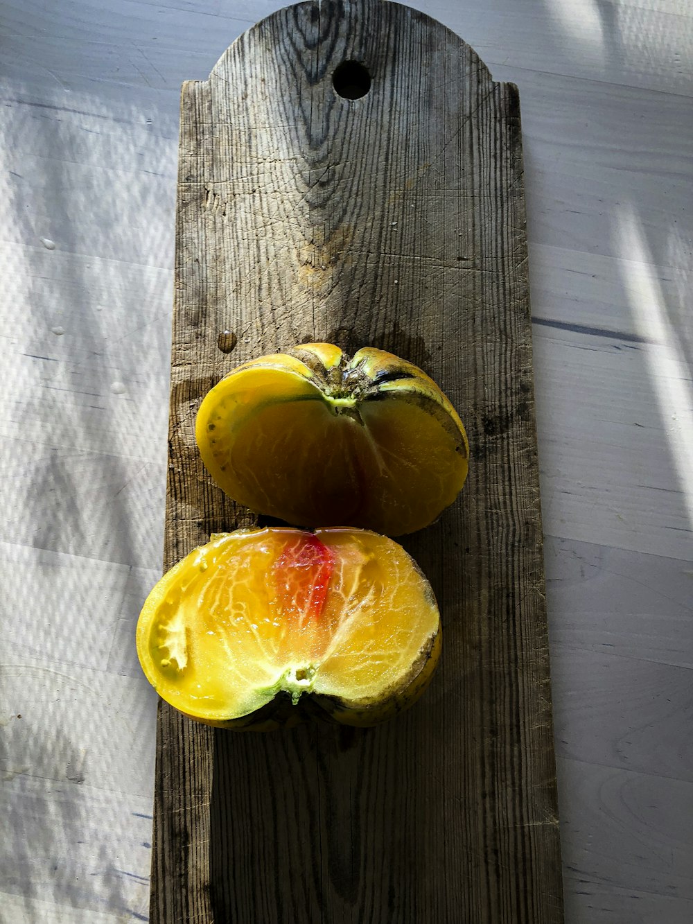 yellow fruit on brown wooden table