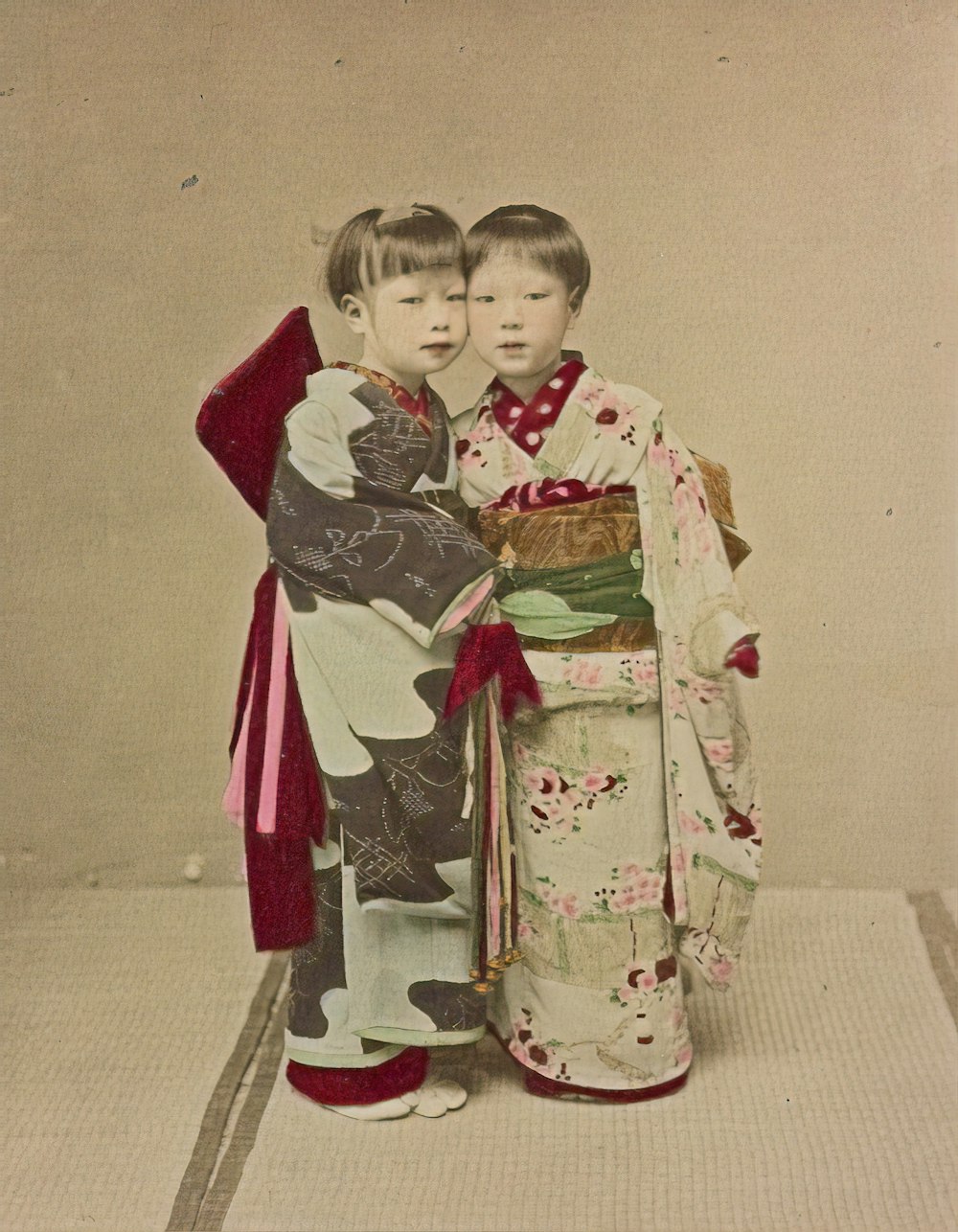 girl in red and white kimono standing on gray concrete floor