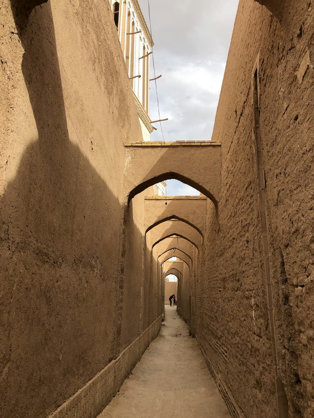 brown concrete tunnel during daytime