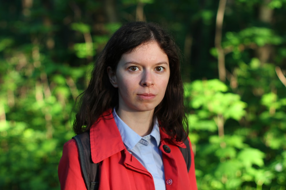 woman in red and white collared shirt