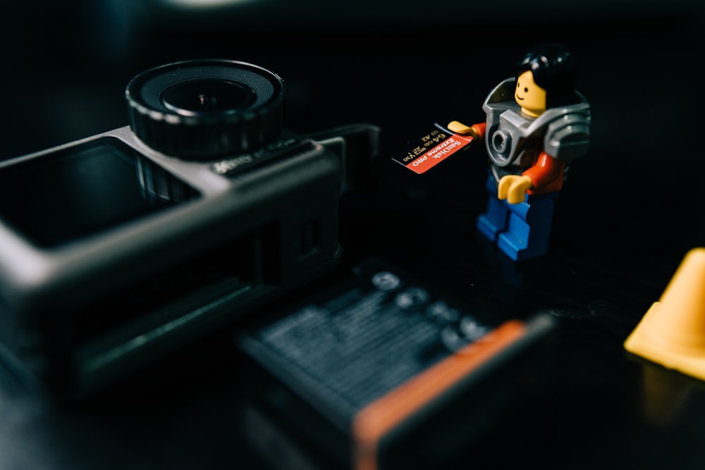 lego mini figure on black surface