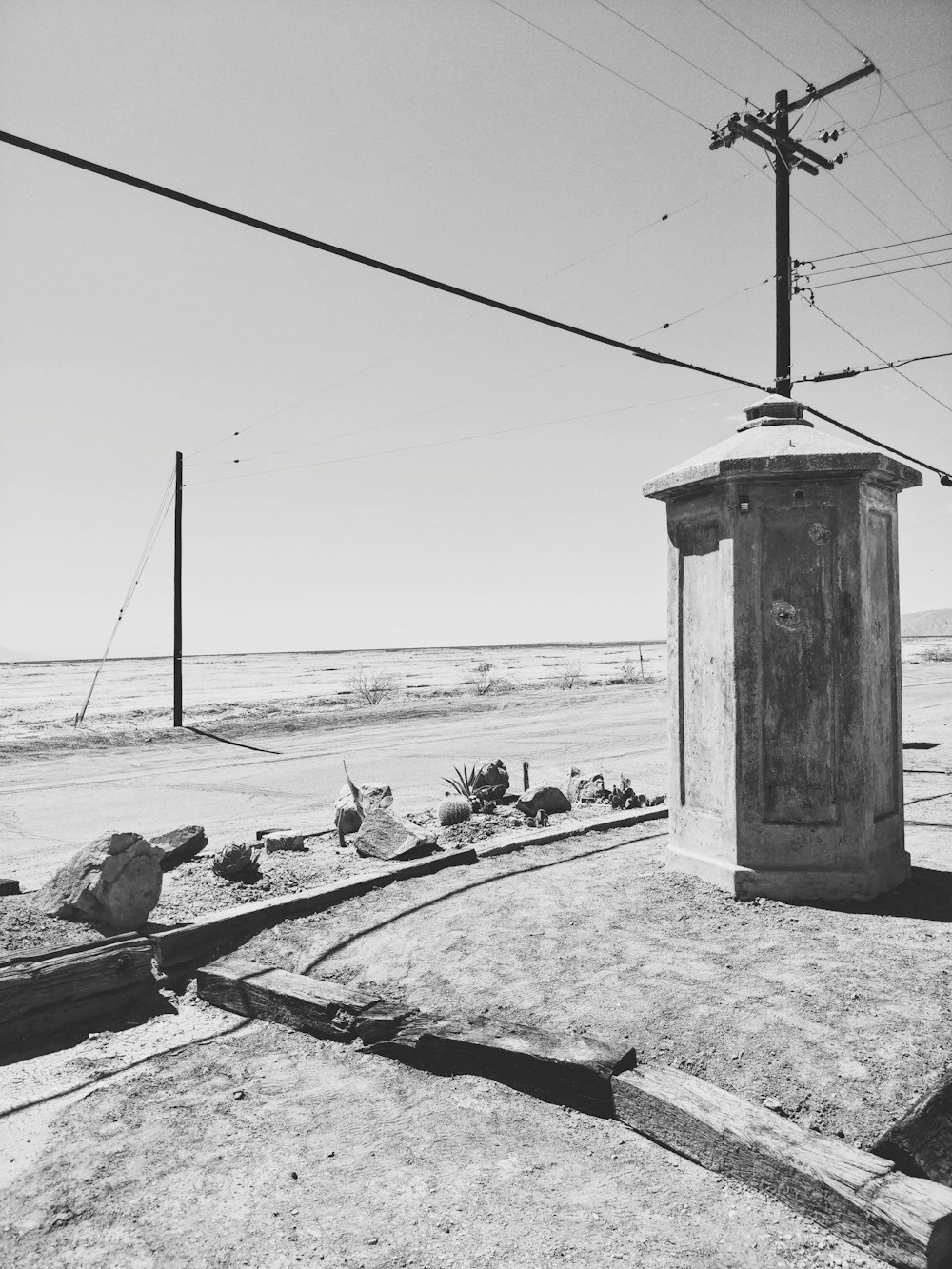 grayscale photo of people on beach