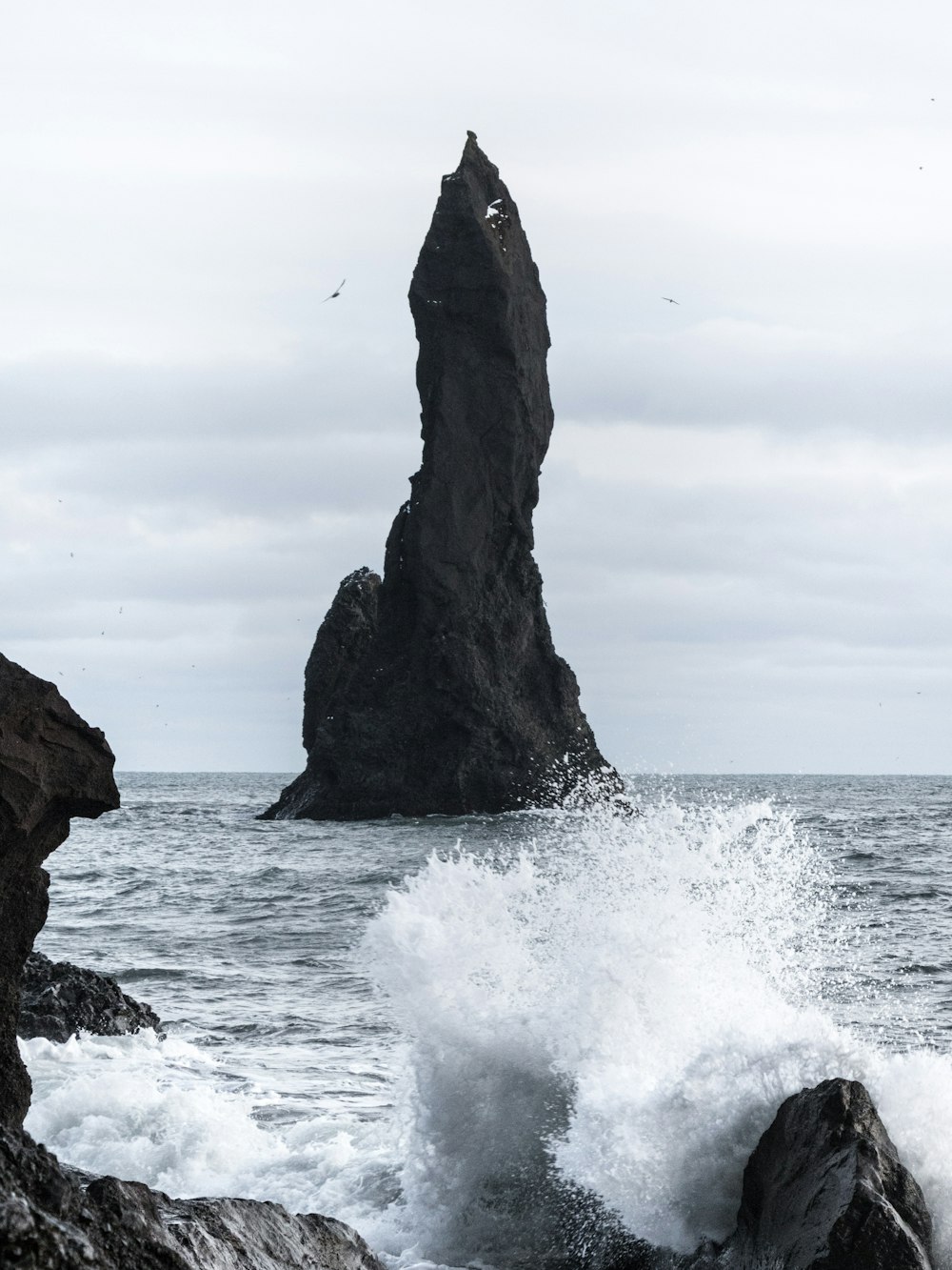 brown rock formation on sea during daytime