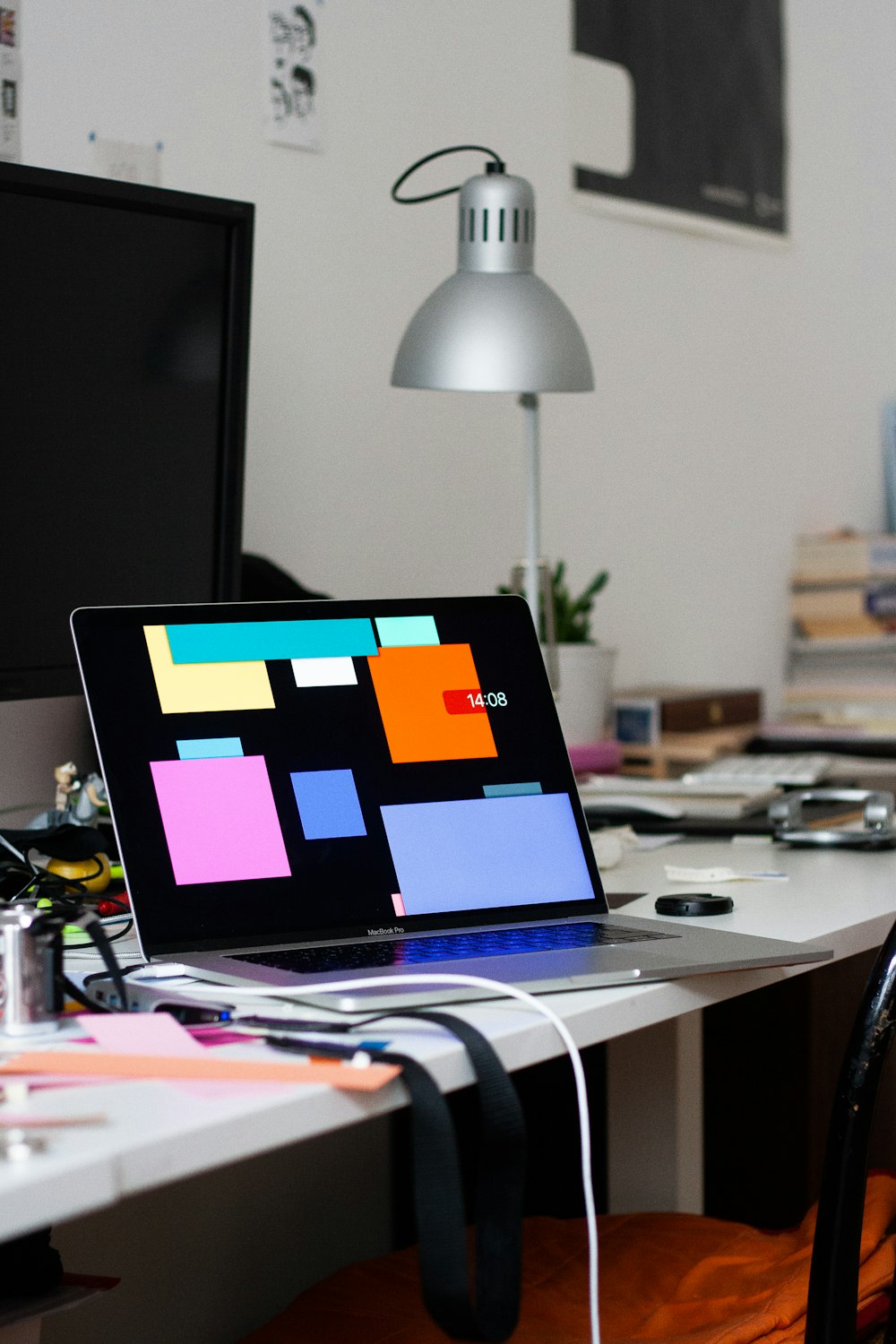 black laptop computer on white table