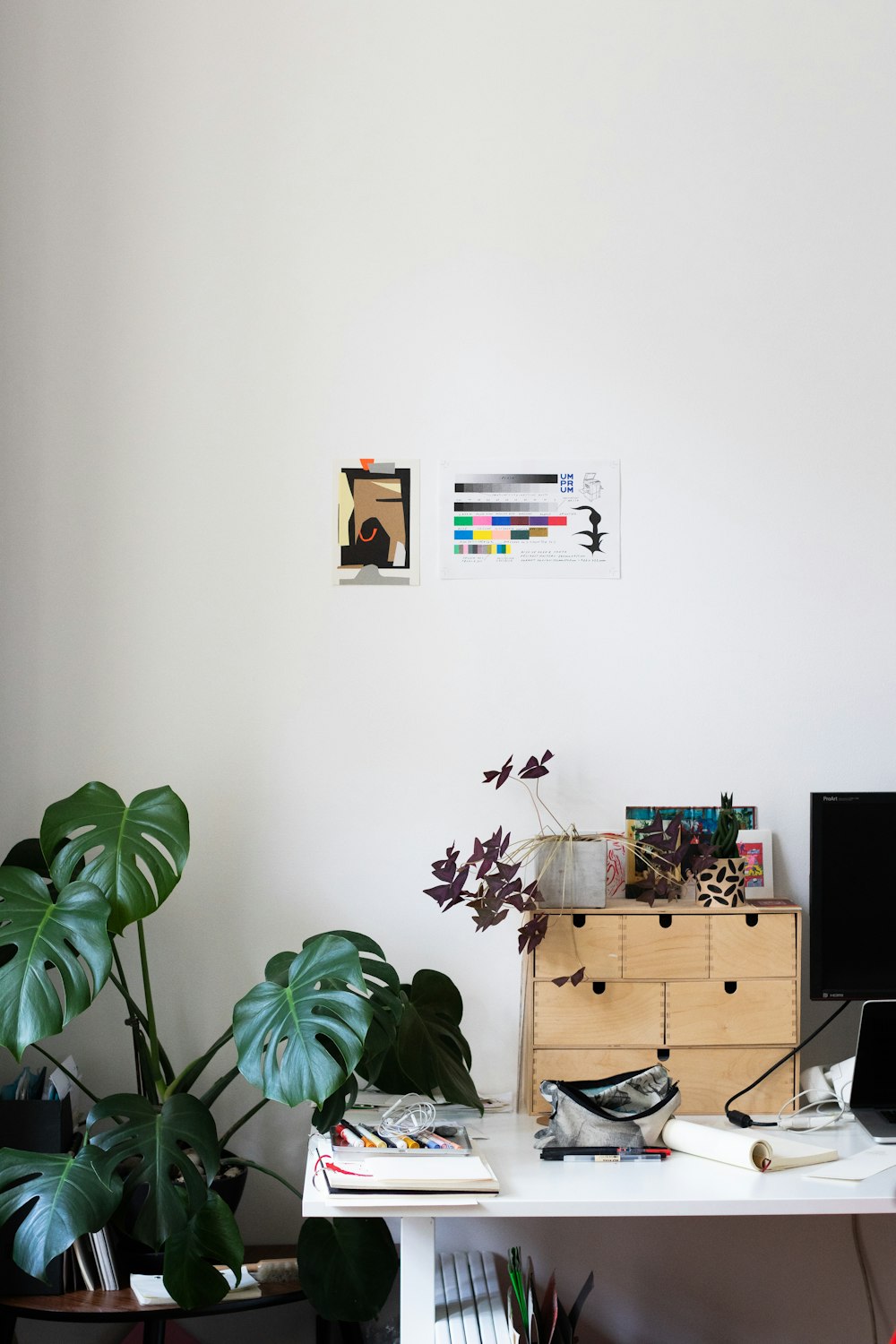 brown wooden drawer beside green plant