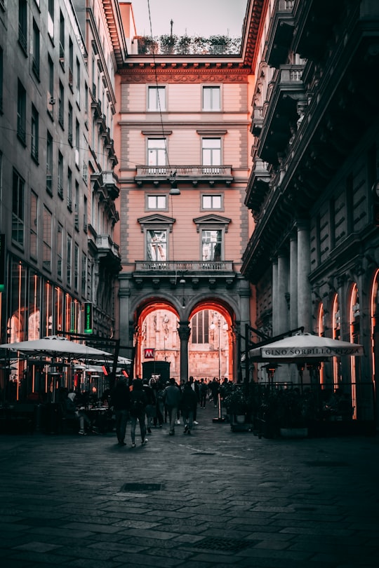 people walking on street near building during daytime in Milano Italy