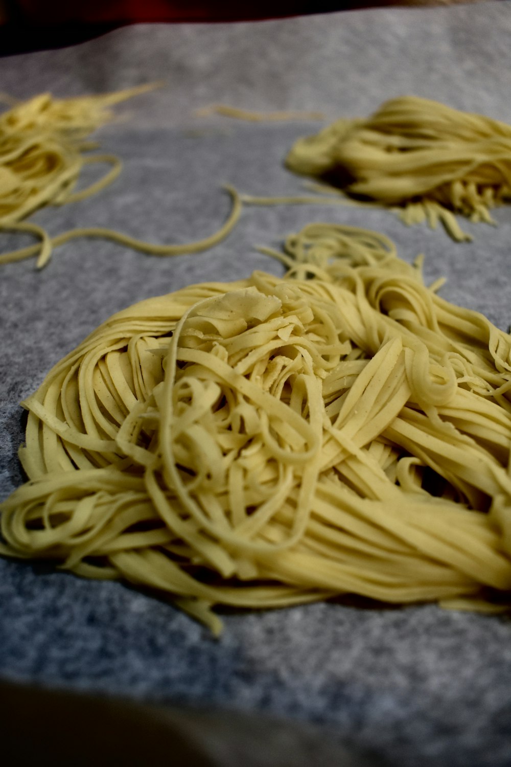 yellow pasta on gray textile