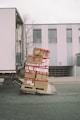 brown cardboard boxes on gray asphalt road