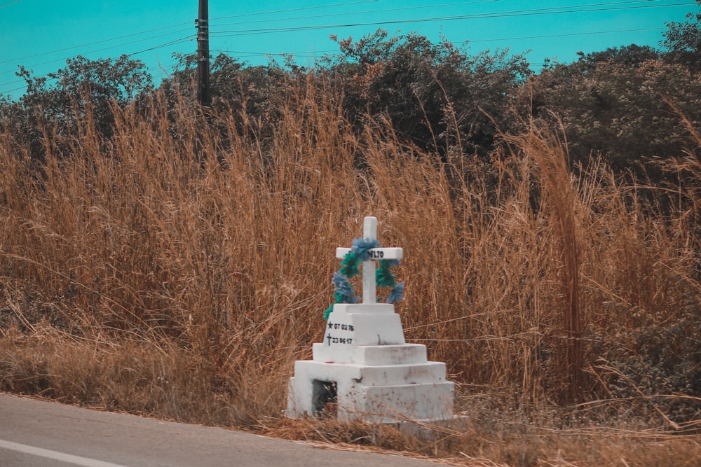 white concrete statue on gray concrete road