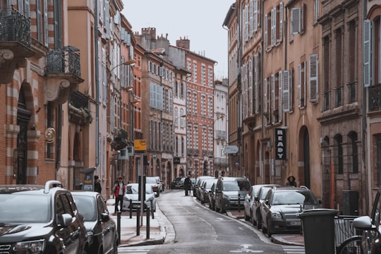 cars parked on the side of the road during daytime in Toulouse France