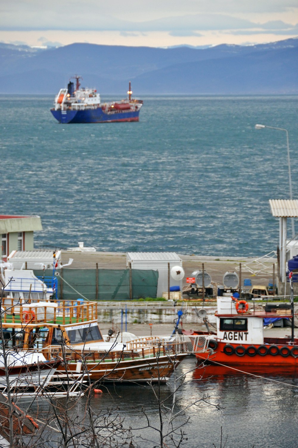 red and white ship on sea during daytime