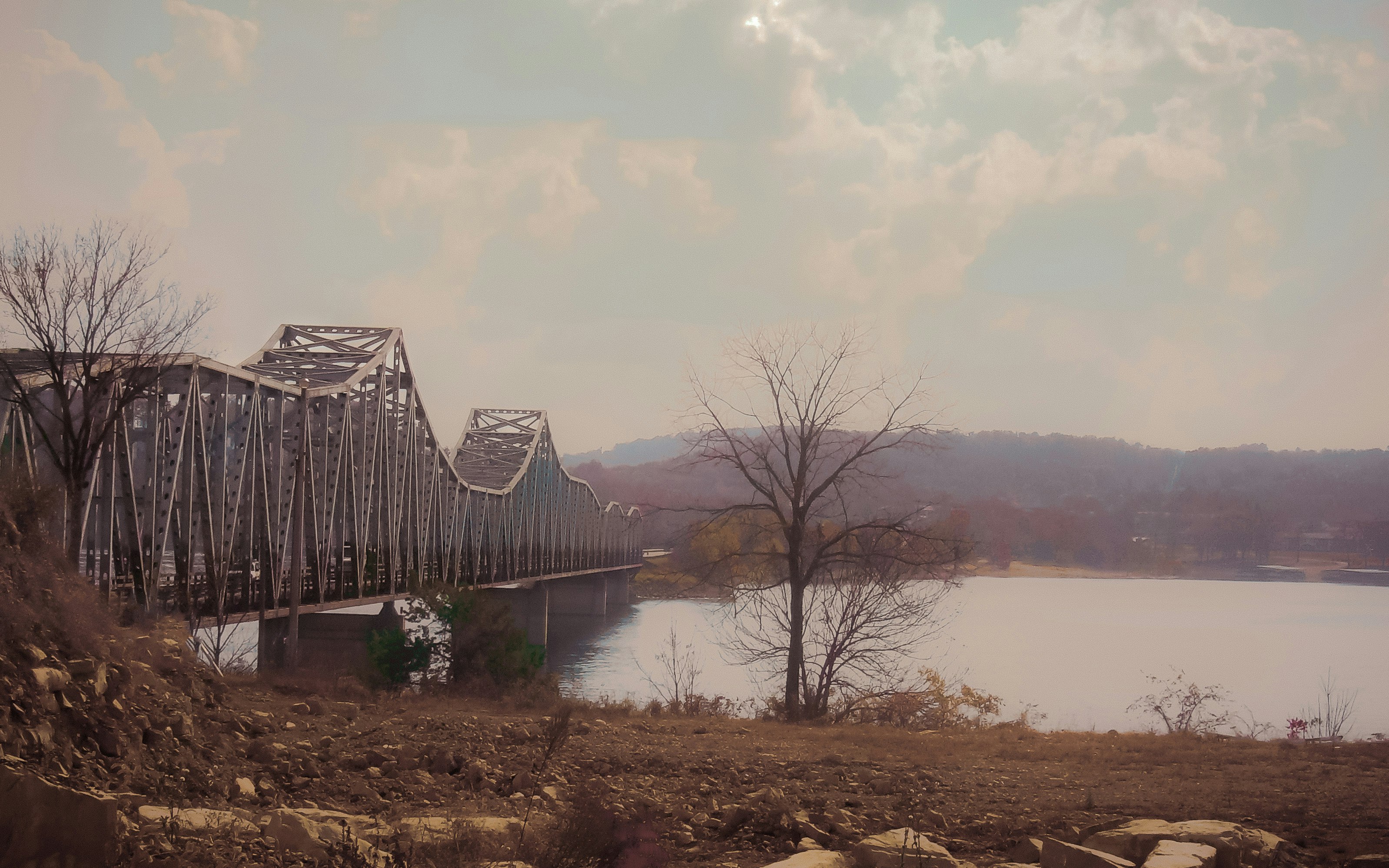 brown wooden bridge over river