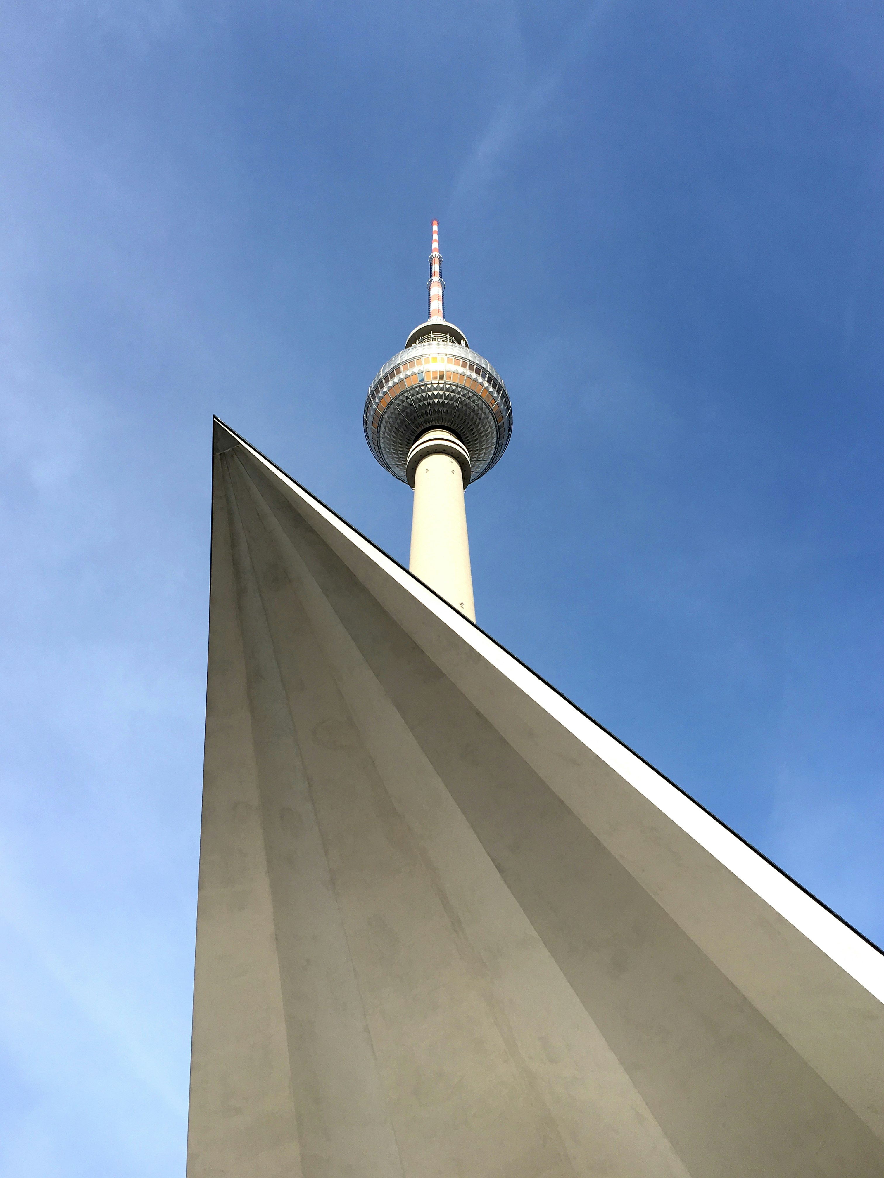 white concrete tower under blue sky during daytime