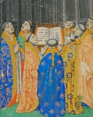 Members of the choir gathered around a priest in traditional vestments.